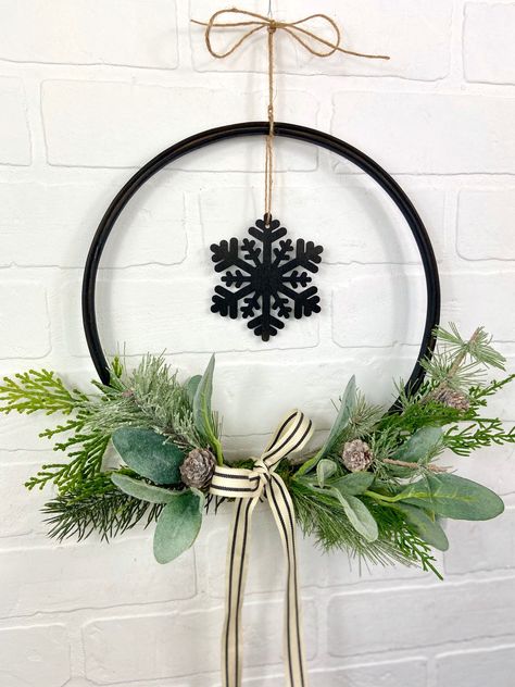 This black Christmas wooden hoop wreath is perfect for your holiday decorating. It is neutral and could remain on your door or wall throughout winter. The simple modern hoop wreath is wonderful as a minimalist decoration for Christmas decor. #christmaswreath #modernchristmas #farmhousechristmas #simplechristmas #blackchristmasdecorations Bauhaus Christmas, Black Christmas Wreath, Unique Gifting Ideas, Modern Christmas Wreath, Black Christmas Decorations, Christmas Tree Decorations Ribbon, Holiday Wreaths Christmas, Material Wreaths, Christmas Craft Projects