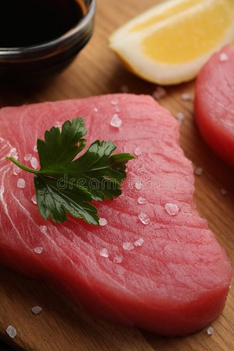 Fresh raw tuna fillet with sea salt and parsley on wooden table, closeup stock photography Raw Tuna, Tuna Fillet, Wooden Table, Wooden Tables, Healthy Cooking, Parsley, Sea Salt, Stock Photography, Salt