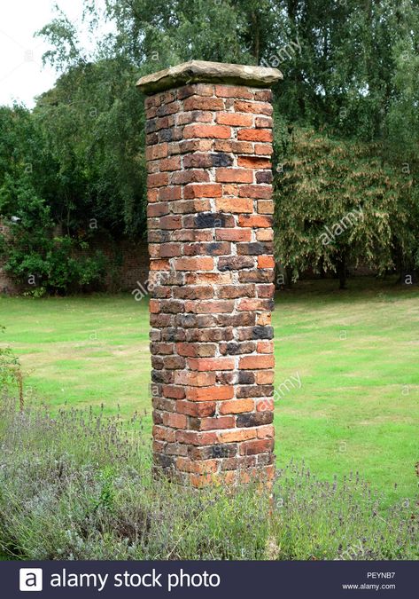 Full height pillar of a victorian garden brick pergola. These these garden brick pillars are now to be renovated Stock Photo Brick Pillars Driveway Entrance, Brick Pergola, Brick Pillars, Driveway Entrance Landscaping, Brick Driveway, Brick Columns, Victorian Gardens, Driveway Entrance, Farm Gate