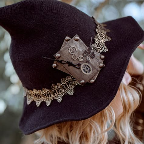 Celebrate Halloween with our Steampunk Witch hat! Are you ready to take your Halloween costume to the next level? Our Steampunk Witch Hat is the perfect accessory to complete your enchanting steampunk-themed look. This hat is designed with the utmost attention to detail, making it a must-have for any cosplay enthusiast. Crafted with a blend of mystical elegance and steampunk charm, this witch hat boasts intricate designs that are sure to captivate attention. The classic black color, coupled with Elegant Witch Hat, Steampunk Witch Hat, Decorate Witch Hat Diy, Decorating Witch Hat Ideas, Steampunk Witch Costume, Fantasy Accessories Art, Witch Hat Aesthetic, Witchy Costume Ideas, Decorated Witch Hat