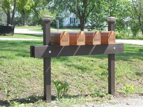 My sister-in-law redesigned group of mailboxes. Her's was on left end. She did this herself with my brother, her husband setting poles in cement. Look alot better, uniform. 3 Mailbox Ideas, Group Mailbox Ideas, Multiple Mailboxes Ideas, Cluster Mailbox Ideas, 4 Mailbox Post Ideas, Community Mailbox Ideas, Triple Mailbox Post Ideas, Multiple Mailbox Ideas, Multiple Mailbox Post Ideas