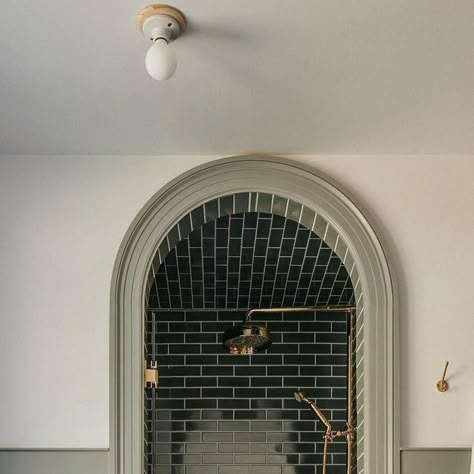 Alexander James Tile Studio on Instagram: "An arched opening creates a dream destination in this moody shower from @corey.lohmann.design. Matching the tone of the rich green tile to the millwork brings it full circle.⁣ ⁣ 𝗦𝗵𝗼𝗽 𝗢𝘂𝗿 𝗦𝗶𝗺𝗶𝗹𝗮𝗿 𝗦𝘁𝘆𝗹𝗲𝘀: Makoto Midori Green 2x10 Matte Ceramic 𝘭𝘪𝘯𝘬𝘦𝘥 𝘪𝘯 𝘣𝘪𝘰⁣ ⁣ ⁣⁣⁣⁣⁣⁣#AlexanderJames | Design: @corey.lohmann.design | Photography: @margaretrajic⁣ ⁣ #tile #ceramictile #tilestyle #lonnyliving #interiordesign #homerenovation #interior123 #bhilivebeautifully" Green Subway Tile, Porcelain Wall Tile, Stunning Bathrooms, December 23, Green Tile, Green Bathroom, Traditional Modern, Tile Work, Beautiful Bathrooms