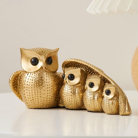 PRICES MAY VARY. Pretty Owl Statue: FJS’s Owl Figurines coated with a layer of shiny gold,intricate design and attention to detail make it an eye-catching statement piece owl statue will enhance any room's living room decor. Modern Room decor, kitchen decor, bathroom decor, bedroom decor, office decor, living room decor, western decor. Owl Fan: This Owl Statue has bright eyes and delicate polka dots. Great for owl lovers who collect different styled. The owl symbolizes strength, power, stability Purple Kitchen Decor, Pretty Owl, Tv Stand Modern, Gold Office Decor, Table Tv Stand, Owl Figurines, Bookshelves With Tv, Room Decor Kitchen, Owl Statue