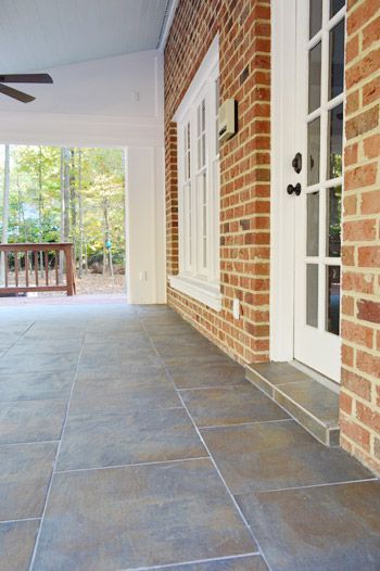 Gorgeous but labor-intensive tile laid over concrete on a porch | Young House Love Tile Patios Over Concrete, Patio Tiles Over Concrete, Outdoor Tiles Floor, Outdoor Tile Patio, How To Tile, Cooking Outdoors, Outdoor Tile, Porch Tile, Adirondack Furniture