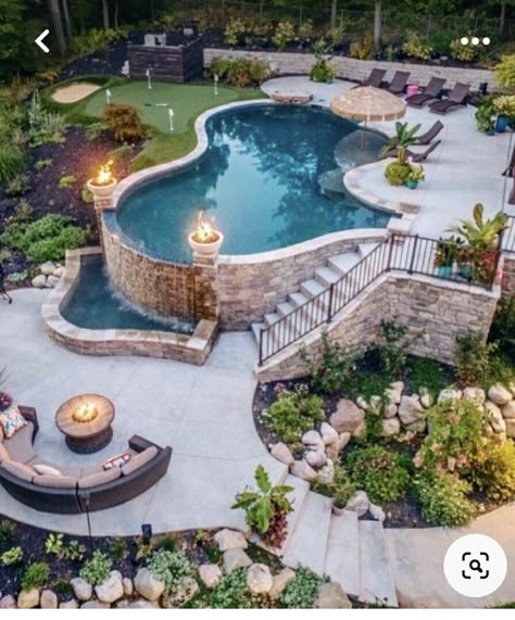 Hot Tub With Pool Ideas Backyard, Amazing Above Ground Pools, Pools On A Sloped Yard, Pool On A Hill Backyards, Epic Backyards, Pool With Retaining Wall Sloped Backyard, Pool Built Into Hillside, Pools Built Into Hillside, Pool On Sloped Yard