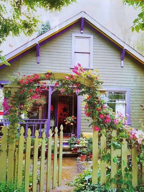 Love this tiny home with purple trim and garden entrance. Green House With Purple Trim, Purple Shutters On House, Green And Purple House Exterior, Periwinkle Exterior House Colors, Colorful Houses Exterior, Purple Exterior House Colors, Colorful Home Exterior, Purple House Exterior, Office Sheds Backyard