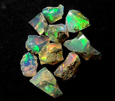 PRICES MAY VARY. Mined - These beautiful fire play raw opals are directly mined from Ethiopia Opal - The name Opal is derived from the Latin opalus and the Sanskrit upala, meaning precious stone. Healing - Encourages both freedom and independence. Opal enhances cosmic consciousness and induces psychic and mystical visions. It stimulates originality and creativity. Helps to release anger and claim self worth, aiding in accessing and expressing one's true self. Metaphysical - Opal has a generally Opal Rock, Yowah Opal, Raw Crystals, Meditation Art, Raw Opal, Rock Jewelry, Opal Color, Energy Stones, Green Opal