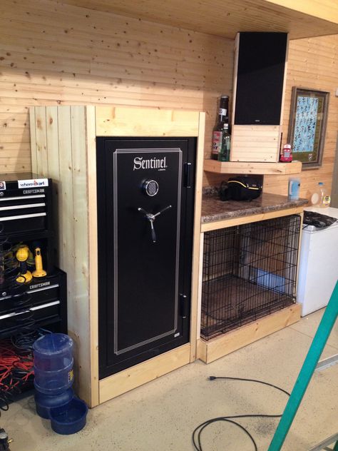 Garage, gun safe, kennel. I really like the framed-in safe, it cleans up the space a lot. Safe In Office, Hunting Storage, Safe Ideas, Reloading Room, Garage Ceiling Storage, Rustic Man Cave, Hunting Room, Luxury Storage, Ceiling Storage