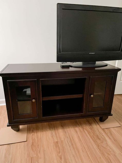 Today, I'm sharing a quick and easy way to upcycle an old entertainment center with mineral paint. It cost me less than $10 to give new life to this piece. Furniture Makeover Tv Stands, Tv Stand Makeover Diy Farmhouse, Refinishing Tv Stand, Entertainment Center Flip, Refurbish Tv Stand, Refinish Tv Stand, Transform Tv Cabinet, Tv Stand Makeover Diy Bohemian, Painting Tv Stand Ideas