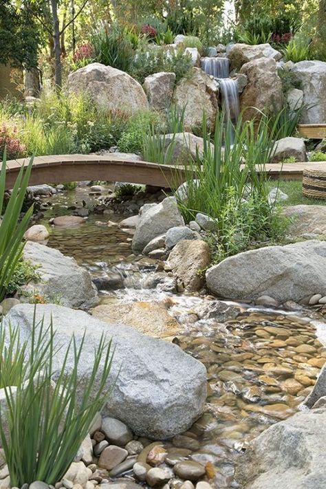 The greatest rain garden design idea is to incorporate a waterfall and pond. This will look good if you have a spacious backyard. It will help in creating a place where you relax amongst nature. Rain Garden Design, Garden Landscaping Design Ideas, Waterfall Landscaping, Garden Stream, Taman Air, Garden Waterfall, Pond Landscaping, Backyard Water Feature, Waterfalls Backyard