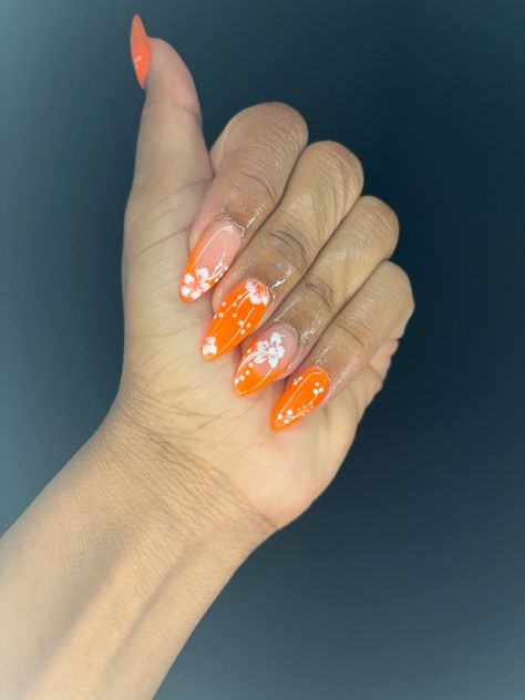 Hawaiian Almond Nails, Almond Hawaiian Flower Nails, Orange French Tip Nails With Flowers, Hibiscus Nail Art Almond, Almond Nails Hawaii, Almond Shape Flower Nails, Hibiscus Flower Nails 2000s, Hibiscus Flower Nails Orange, Orange Nails With White Flowers