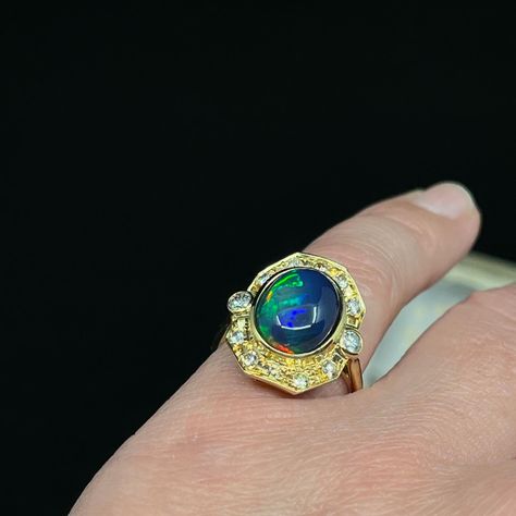 We love this solid Opal ring, if anything it has a bit of an air of 1980’s spunk 😁 The oval solid Opal originates from Ethiopia and its bezel set within an Etruscan reminiscent boarder in 18K yellow gold, set with 12 round brilliant cut Diamonds which are graded in the setting, G to light Champagne. We know how we feel about Champagne Diamonds 🫠🥂 This Opal is dominantly azure blue with flashes of apple green and carnelian. 👌🏽we love it. This ring is now reduced half price making it totally... Blue Mountains Australia, Emerald Cut Rings, Emerald Engagement Ring Cut, Azure Blue, Art Deco Engagement Ring, Half Price, Champagne Diamond, Apple Green, Art Deco Ring