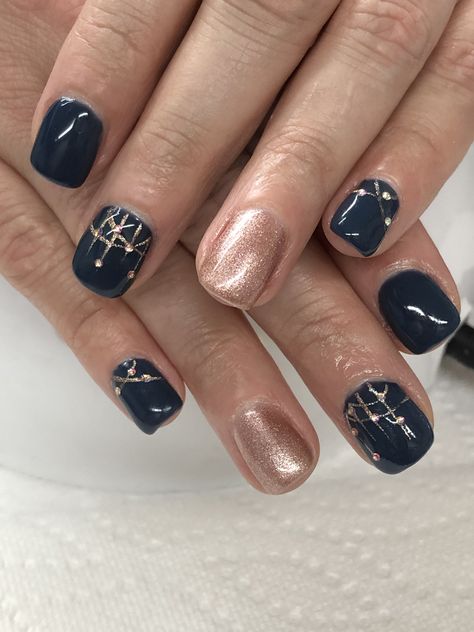 Navy and Rose Gold Gel Nails Navy Blue With Rose Gold Nails, Navy And Gold Nails Wedding, Navy Blue And Rose Gold Nail Designs, Navy Rose Gold Nails, Dark Blue And Rose Gold Nails, Navy Blue New Years Nails, Blue And Copper Nails, Blue And Rose Gold Nails, Navy And Gold Gel Nails