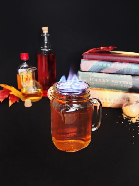 Harry Potter themed cocktail made from butterbeer and firewhisky. Perfect for Harry Potter themed parties. Also a great flaming Halloween cocktail or fall cocktail. Fire cocktails. // www.ElleTalk.com #WhikseyCocktail #ElleTalk #CocktailRecipe #DrinkRecipe Fire Cocktails, Coconut Rum Recipes, Dark Rum Cocktails, Harry Potter Cocktails, Hot Buttered Rum Recipe, Harry Potter Drinks, Rum Punch Recipes, Daiquiri Recipe, Rum Cocktail Recipes