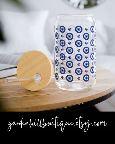 Evil Eye Tumbler 🧿✨🪬🌙 Check Out Our New Glass Tumblers! gardenhillboutique.etsy.com #evileye #evileyes #evileyeprotection #evileyesoff🧿🖤 #boho #sustainability #sustainablefashion #sustainable #sustainableliving #tiktokmademebuyit #fyp #fypシ #fypage #foryoupage #foryourpage Evil Eye Tumbler, Glass Cup With Lid, Greek Evil Eye, Good Luck Gifts, Glass Tumblers, Eye Glass, Cup With Lid, Refreshing Cocktails, Tumbler Gift