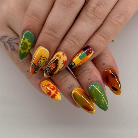 Shout out to the most amazing bf for taking these pictures of my birthday nails!!🤭🤭 But these are my fallout inspired nails🤠☢️👩‍🔧. I am in loveeeee and I can’t wait for yall to see them in person LOL. ***And I did vault 24 because my 24th birthday is tomorrow 🥳!! #fallout #falloutart #fallout4 #fallout76 #fallout3 #newvegas #falloutnails #videogamenails #pipboynails #nukacola #3dnails #nailart #nailtok #nailsofinstagram #nailsvideotutorial #nailsnailsnails #naildesign Fallout Nails, My 24th Birthday, Fruit Nails, Pip Boy, Fallout Art, Gel Mani, 24th Birthday, Inspired Nails, Birthday Nails