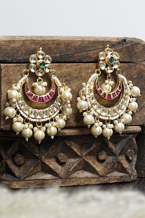 Gold-plated chandbali earrings with floral motif top, crescent moon carved motifs, kundan stones and pearl embellishments. Type: Kundan, Pearl Composition: Brass Color: Gold Carved motifs Multi pearl drops Weight (in gms): 25 Size (in inch): 2 - Aza Fashions Chandbali Earrings, Earrings Design, Jewellery Earrings, Gold Earrings Designs, Silver Jewelry Fashion, Ear Rings, Buy Gold, Gold Brass, Pearl Drop