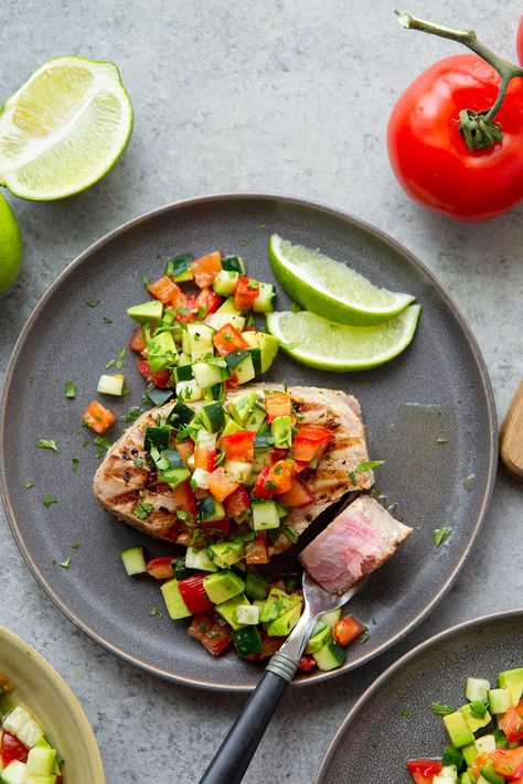 Tuna steaks are marinated in cilantro and fresh lime, grilled until perfectly cooked, and topped with a fresh avocado cucumber salsa. - This cilantro lime grilled tuna will quickly become a grill staple! Tuna With Avocado, Cilantro Lime Marinade, Grilled Tuna Steaks, Pregnancy Meals, Ahi Tuna Steak, Tuna Steak Recipes, Cucumber Salsa, Grilled Tuna, Tuna Steak