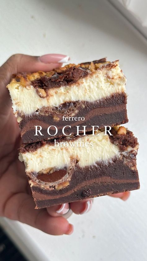 Ferrero Rocher Cheesecake Brownies – a divine fusion of fudgy brownies, velvety cheesecake, and the irresistible charm of crunchy Ferrero… | Instagram Chocolate Bar Brownies, Christmas Brownies Ideas, Showstopping Desserts, Ferrero Rocher Dessert, Ferrero Rocher Brownies, Candy Brownies, Ferrero Rocher Cheesecake, Traybake Recipes, Brownies Cheesecake