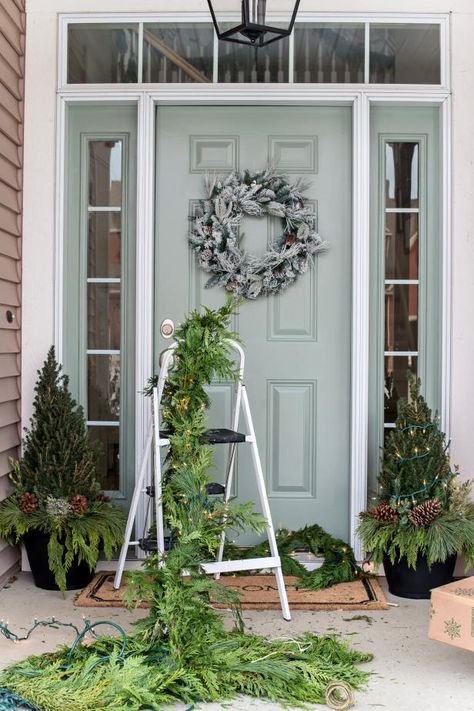 Front Porch Christmas Garland Ideas, Garland Around Front Door, Outdoor Christmas Garland, Porch Garland, Evergreen Garland, Elf On The Shelf Arrival, Outdoor Garland, Front Gardens, Miss Mustard Seed