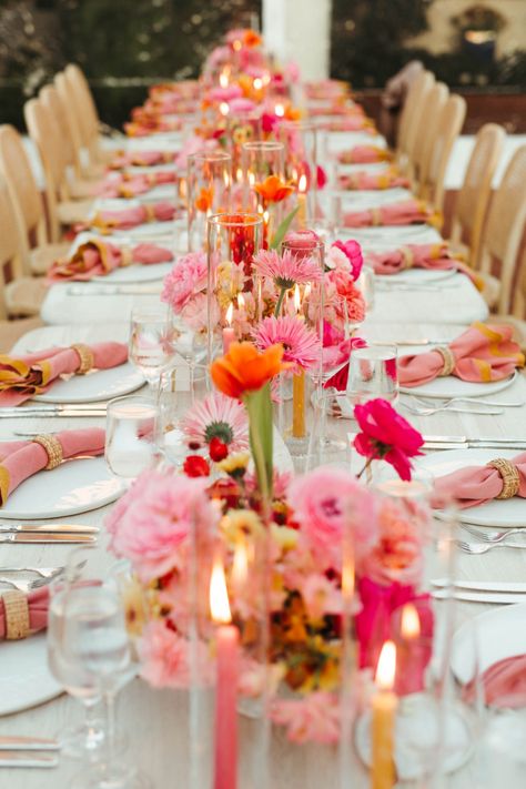 Taylor and Cale were set on wanting a tent for their reception, so they brought in a clear tent so guests could still enjoy the natural beauty of the venue. From there, Always Flawless Productions created a breathtaking statement piece of jute chandeliers and bougainvillea that ‘wowed’ guests as the made their way into the reception. This set the tone for the evening and perfectly paired with the whitewashed tables, natural wood chairs, and brightly colored florals. Pink And Orange Bud Vases Wedding, Pink Yellow Weddings, Bright Wedding Decorations, Pink Table Settings, Bright Pink Wedding, Orange Wedding Themes, Orange And Pink Wedding, Darlington House, Bright Wedding Colors