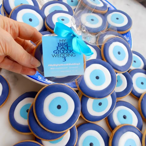 Evil Eye biscuits, custom made by Take The Biscuit UK for the premier of "My Big Fat Greek Wedding 3". London UK delivery only. Greek Party Decorations Ideas, Greek Themed Engagement Party, Greek Pool Party, Greek Hen Party, Greece Birthday Theme, Evil Eye Cookies, Greek Engagement Party, Greece Theme Party, Greece Birthday Party Ideas