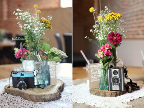 Vintage Camera Wedding Decor, Vintage Camera Centerpiece, Decorating With Vintage Cameras, Camera Centerpiece Ideas, Artsy Centerpieces, Camera Centerpieces, Table Names, Old Camera, Rustic Barn Wedding