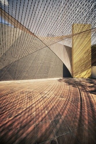 "Eco Pavilion": Extending the play of angles and light that are one the hallmarks of the Museo Experimental Eco (by artist Matthias Goeritz, 1953), this award-winning temporary pavilion uses parallel lines of rope to define a parabolic "roof" above the central courtyard. | 2011, MMX Shade Structure, Space Architecture, Travel List, Architectural Inspiration, Green Building, Amazing Architecture, Architecture Building, Mexico City, Interior Architecture Design