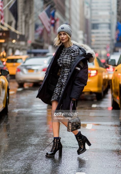 Lisa Hahnbueck wearing Canada Goose Resolute Parka, Isabel Marant Gathered Tartan Dress in Cotton via Stylebop, Louis Vuitton STAR TRAIL ANKLE BOOT, JIMMY CHOO LOCKETT BAG, PRADA SUNGLASSES on February 12, 2017 in New York City. Fall Boot Trend, Walking Down The Street, Nyfw Street Style, Street Style Trends, Autumn Street Style, Womens Fashion For Work, Chunky Boots, Cool Street Fashion, Street Style Looks