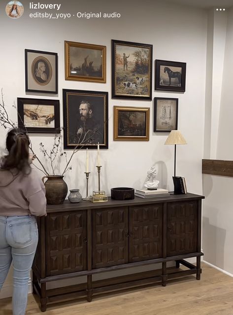 Gallery Wall Entry Table, Timeless Vintage Living Room, Art Above Credenza, Photos Above Buffet Table, Amber Interiors Gallery Wall, Sideboard With Gallery Wall, Moody Bedroom Gallery Wall, Dark Sideboard Decor, Moody Tv Stand