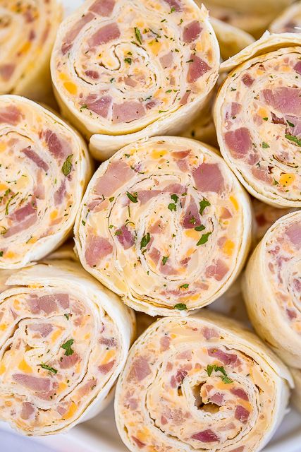 Ham & Cheese Pinwheels - I am ADDICTED to these sandwiches! All the flavors of my favorite Hot Party Ham Sandwiches wrapped in a tortilla.Cream cheese, ham, cheddar, swiss, Worcestershire sauce, dijon mustard, brown sugar, and onion powder wrapped in a tortilla. So simple to make. Can make ahead of time and refrigerate until ready to eat. Perfect for parties and tailgating!! #pinwheels #ham #tailgating #sandwich #partyfood Party Ham Sandwiches, Easter Appetizer Recipes, Ham Cheese Pinwheels, Pinwheels Appetizers, Tortilla Pinwheels Recipe, Easter Appetizers Easy, Ham And Cheese Pinwheels, Tortilla Pinwheels, Pinwheel Sandwiches