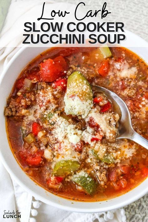 Close up of a tomato based low carb soup recipe with ground beef, zucchini, celery and cheese in a whote bowl with a silver spoon. Keto Zucchini Soup, Low Carb High Protein Slow Cooker Meals, Crockpot Zucchini Recipes, Zucchini Chili Recipe, Low Carb Stew, Sausage Soup Crockpot, Fall Soups Crockpot, Healthy Delicious Soups, Sausage Slow Cooker