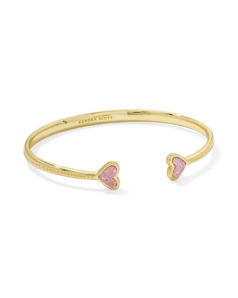 We’re crushin’ on our sweetest icon, and with the Framed Ari Heart Gold Cuff Bracelet in Light Pink Drusy, you can clearly see why! Made to be adjustable for a perfect fit, this cuff is bookended by two darling heart stones in a sleek metal frame, embellished with our signature hoofprint detailing for that extra KS touch. Metal 14k Yellow Gold Over Brass Material Light Pink Drusy Closure Adjustable Size 2.28" Inner Diameter, 0.34"L X 0.3"W StationsDue to the one-of-a-kind nature of the medium, e Gold Kendra Scott Earrings, Bf Gf Matching Jewelry, Christmas Gifts For Mom From Daughter To Buy, Real Gold Bracelets, Cute Gift For Mom, Pink And Gold Bracelet, Pink Gifts Ideas, Cheap Boyfriend Gifts, Best Friends Christmas Gifts