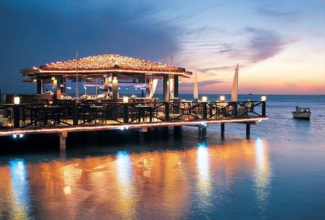 Aruba Restaurants | 10 Best Restaurants in Aruba | Islands Aruba Restaurants, Aruba Island, Oranjestad Aruba, Sunset Restaurant, Seaside Restaurant, Aruba Travel, Oranjestad, Romantic Sunset, Waterfront Restaurant