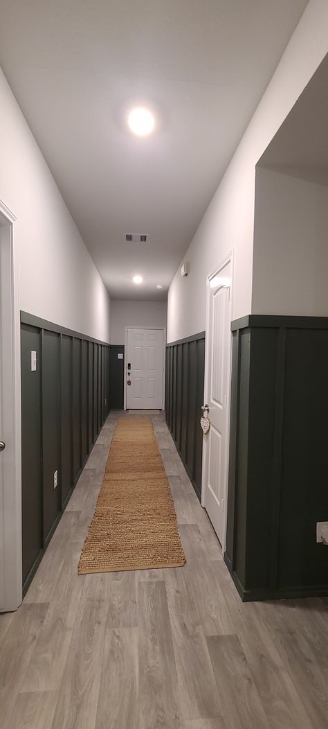 Grey green hallway board and batten Board And Batten Wall Black And White, Board And Batten Height Hallway, Basement Long Wall Ideas, Deep Green Board And Batten Wall, Long Office Hallway Decorating, Dark Board And Batten Hallway, Dark Board And Batten Entryway, Board And Batten Long Wall, Green Board And Batten Wall Dining Room