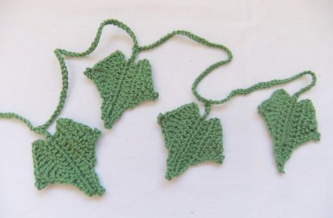 "Ivy". This Christmas crochet pattern is worked in rows and the finished ivy is 6cm (2.5”) in length . These along with some holly and mistletoe could make a perfect Christmas wreath but the ivy could also be used as a brooch, to embellish bags or simply as a decoration. Ivy © Siona Karen 2011 Crochet Vines And Leaves, Crochet Ivy Leaves Free Pattern, Crochet Ivy Leaf Free Pattern, Crochet Ivy Leaf Pattern, Crochet Ivy, Crocheted Wreaths, Crochet Leafy Vine Pattern, Ivy Crochet, Knitted Leaves