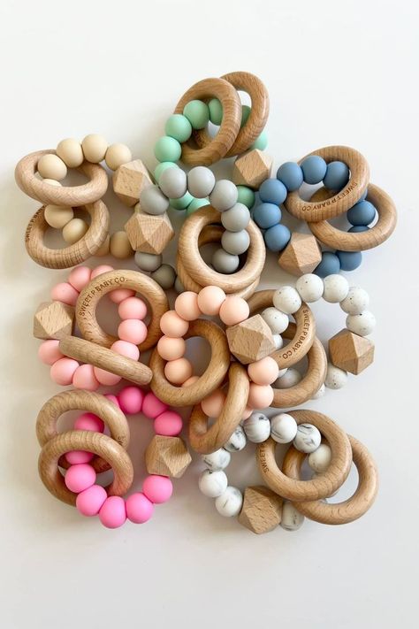 This handmade wooden teethers are made with BPA Free food grade silicone teething beads & natural beech wood. #teethers #woodenteethers #babyteether Diy Teething Toys, Keychain Business, Diy Teethers, Silicone Teething Beads, Wooden Baby Rattle, New Mom Gift Basket, Wood Teethers, Mom Gifts Box, Handmade Baby Items