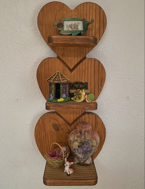 Three tiered heart shelf with cottage core nick knacks Wooden Heart Shelf, Fairycore Furniture, Goodwill Finds Thrifting Home Decor, Heart Shelves, Cottagecore Bookshelf, Cottagecore Furniture, Fairycore Decor, Cottagecore Wall Decor, Heart Shelf