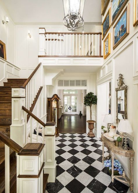 Traditional style entry and staircase in a classic house by The Fox Group. Black and white check floor, white trim, and warm wood on stairs. #traditionaldesign #classicdecor #entry #staircase #housedesign #interiordesigninspiration The Fox Group, White Foyer, Fox Group, Entryway Tile, Custom Home Plans, Black And White Tiles, Black And White Marble, Style At Home, White Tiles