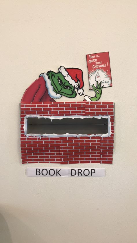 Grinch book drop Library Book Displays December, Grinch Library Decorations, Library Book Return Box Cute Ideas, Winter Holiday Library Displays, Library Book Drop Box Ideas, Grinch Library Bulletin Boards, Book Return Box Ideas, Christmas Library Decor, Library Book Drop Decoration