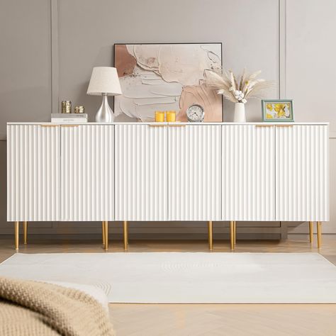 PRICES MAY VARY. 【Upscale Minimalist Design】With its modish Scandinavian fluted elements and white spray-painted finish, this sideboard seamlessly blends style and functionality, making it a versatile addition to any home decor. 【Practical Features】With 6 level adjustable shelves, a weight capacity of 55 lbs for the interior, and 66 lbs for the top surface, this buffet cabinet provides ample storage space for all your cherished items. 【Durable Material】The spray-painted finish surface is easily Dinning Room Cabinets Ideas Modern, Wooden Credenza, Wood Sideboard Buffet, White Storage Cabinet, Dining Room Navy, Living Room Cupboards, Mini Mansion, Hair Room, Console Table With Storage