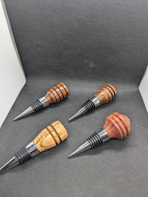 Hand turned wine bottle stoppers. They came from an unlabeled assorted bag of blanks and for that I am sorry. Finished with Walrus oil which is butcher block oil! Wood Turned Wine Stopper, Bottle Stoppers Ideas, Butcher Block Oil, Wood Bottles, Pagosa Springs, Wood Turning Lathe, Turning Projects, Lathe Projects, Driftwood Crafts