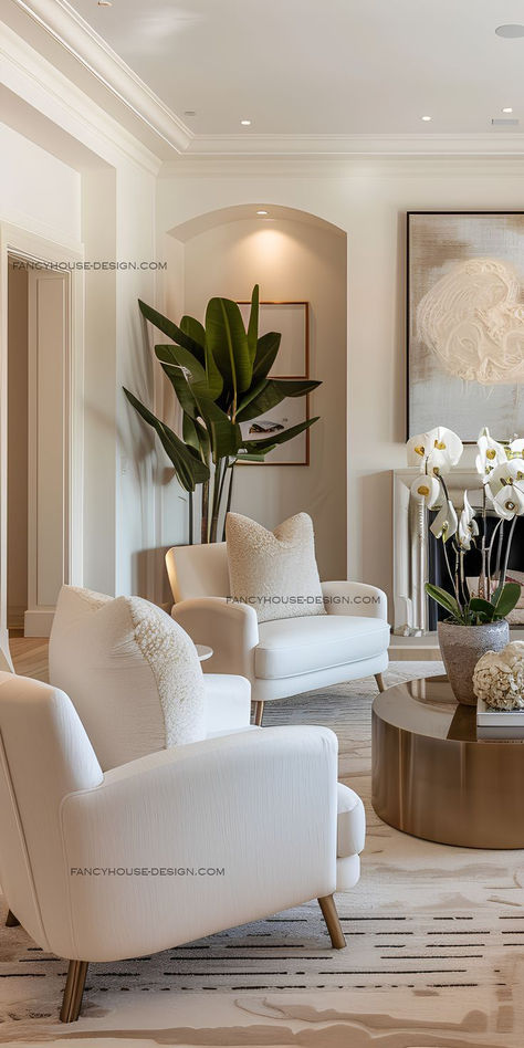 Modern living room with white armchairs, a gold coffee table, indoor plants, and minimalist artwork, showcasing a neutral and elegant design. Formal Living Room Designs, Living Room Decor Lights, Classy Living Room, Clean Aesthetic, Elegant Living Room, Living Room Ideas, Formal Living Rooms, Floor Decor, Dream Home Design