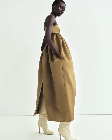 The Liet Dress, crafted from Italian double-faced duchess satin in a bronze hue, features a strapless top and full skirt, with hidden side pockets for effortless elegance. Minimal Fashion Editorial, Fashion Brand Marketing, Spring Summer Shoes, La Living, Spring Runway, Adam Lippes, Moodboard Inspiration, Trend Forecast, Donna Summer