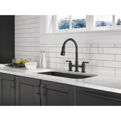 Delta Broderick Pull Down Two Handle Bridge Kitchen Faucet | Wayfair Touch Kitchen Faucet, Delta Kitchen Faucet, Delta Trinsic, Touchless Kitchen Faucet, Glass Rinser, Sink Soap Dispenser, Cleaning Faucets, Soap Dispensers, Delta Faucets