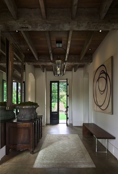 Gwen Driscoll  rustic foyer entrace design with exposed wood beams, black indoor lantern, modern walnut skinny bench, travertine floor, black glass french doors, vintage mirror and credenza. Exposed Beams Ceiling, Rustic Hallway, Entrance Way, Lodge Style, Exposed Beams, Exposed Wood, Inspiring Spaces, Wood Ceilings, Cool Ideas