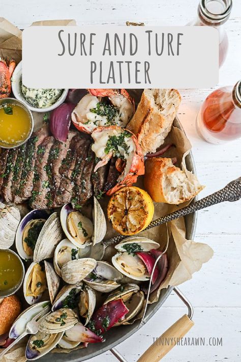 An image of a surf and turf platter with steak, lobster and clams. Christmas Dinner Surf And Turf, Surf And Turf Dinner Sides, Surf And Turf Charcuterie Board, Surf And Turf Fondue, Surf And Turf Board, Surf And Turf Dinner Party, Surf And Turf Platter, Summer Platter, Grilled Surf And Turf