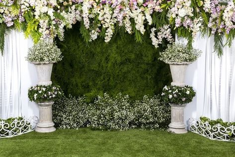 Celebrate your special day surrounded by lush greenery with a botanical wedding backdrop setup! Using a large green garden wall backdrop mat creates the perfect canvas for your love story, draped with flowing white sheer organza curtains and adorned with gorgeous faux wisterias and fern leaves in shades of pink, purple, and ivory. Background decorations feature beautiful white silk baby's breaths arranged in white plastic planters and bushes, adding a touch of elegance to your wedding photos. Studio Camera, Video Backdrops, Flower Backdrop Wedding, Ivy Wall, Marriage Photography, Background Studio, Flower Curtain, Flower Tapestry, Romantic Wedding Photography