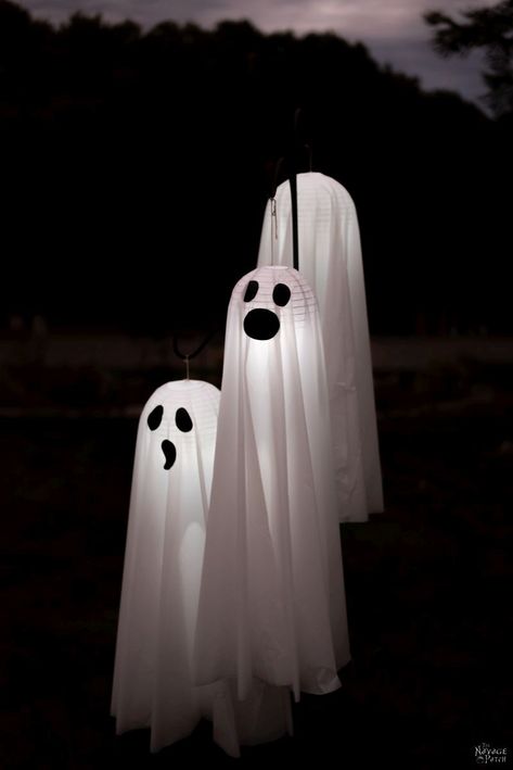 Easy Lighted Hanging Ghosts (A Dollar Store DIY) | DIY lighted hanging yard ghosts - rainproof | Repurposed plastic table cloths | Upcycled Dollar Store paper lanterns | How to make a life size hanging ghost with lights | DIY life-size Halloween prop | #TheNavagePatch #Upcycled #easydiy #DIY #Halloweendecor #DollarStore #HowTo #Halloween #Repurposed #DollarTree #ghost | TheNavagePatch.com Dollar Store Halloween Diy, Yard Ghosts, How To Make Ghosts, Diy Halloween Ghosts, Dollar Tree Halloween Decor, Floating Ghosts, Witch Props, Ghost Crafts, Lights Diy