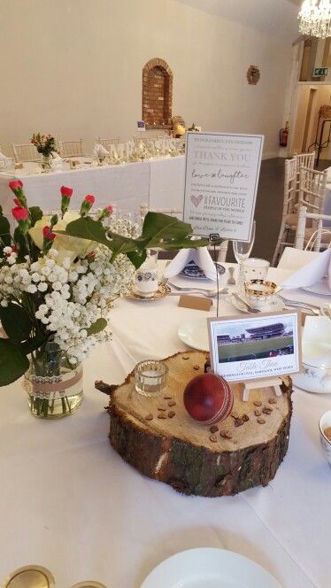 Centrepiece on log with cricket ball, cricket ground and a personalised thank you card. Rustic theme wedding with lace, wood slices, logs, candles and cricket grounds. By Wow I Like That. Cricket Wedding, Rustic Theme Wedding, Blue And Blush Wedding, Cricket Ball, Cricket Ground, Cricket Balls, Cricket Club, Dinner Decoration, Rustic Theme